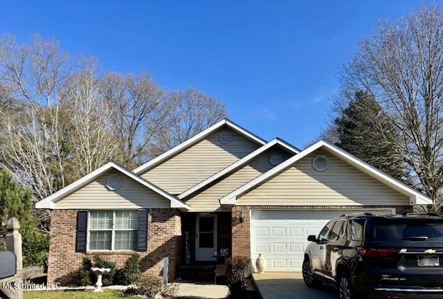 single story home with brick siding, concrete driveway, and an attached garage