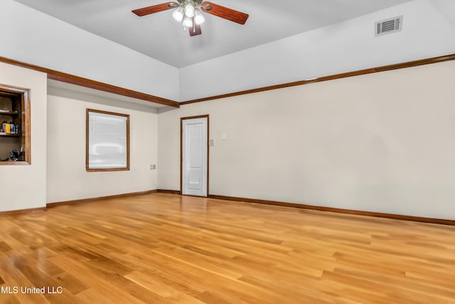 spare room with light wood-style floors, a ceiling fan, and baseboards