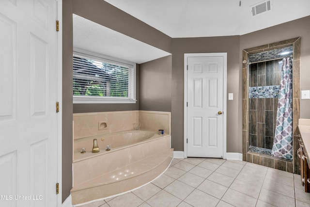 full bathroom featuring a stall shower, a garden tub, tile patterned floors, and baseboards