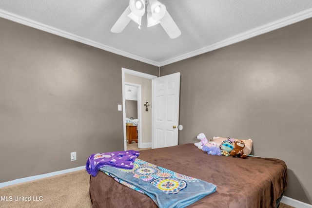 carpeted bedroom featuring ornamental molding, baseboards, a ceiling fan, and a textured ceiling