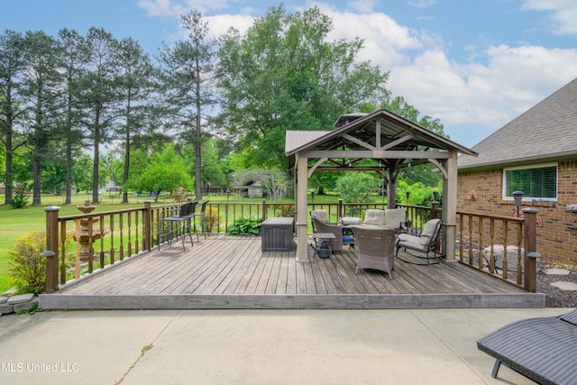 wooden deck with a gazebo and a lawn