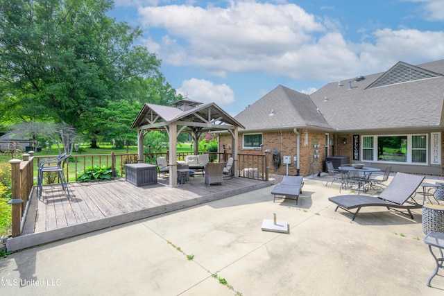 view of patio with a gazebo, a deck, and an outdoor hangout area