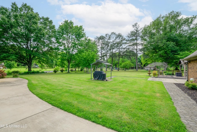 view of green lawn with a gazebo