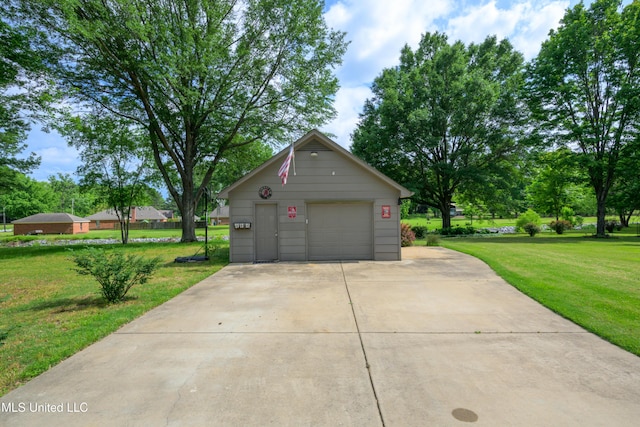detached garage featuring driveway