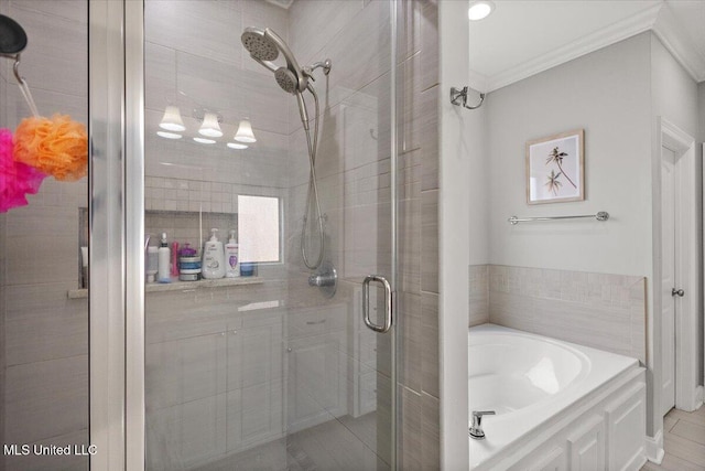 full bath featuring a stall shower, a garden tub, and crown molding