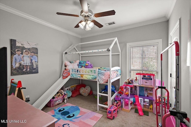 carpeted bedroom with ornamental molding, visible vents, and a ceiling fan