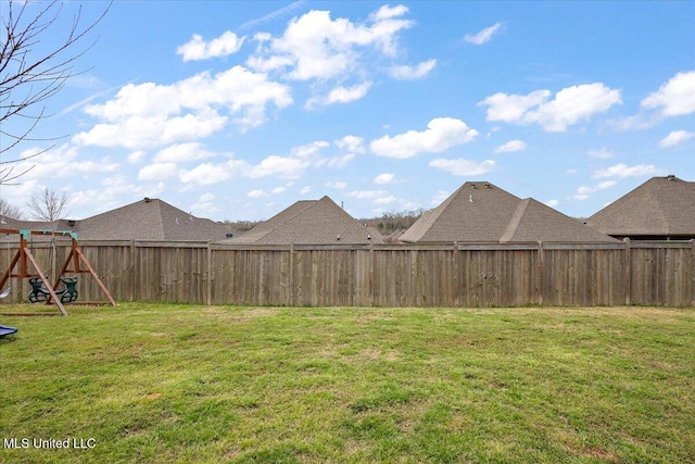 view of yard with a fenced backyard