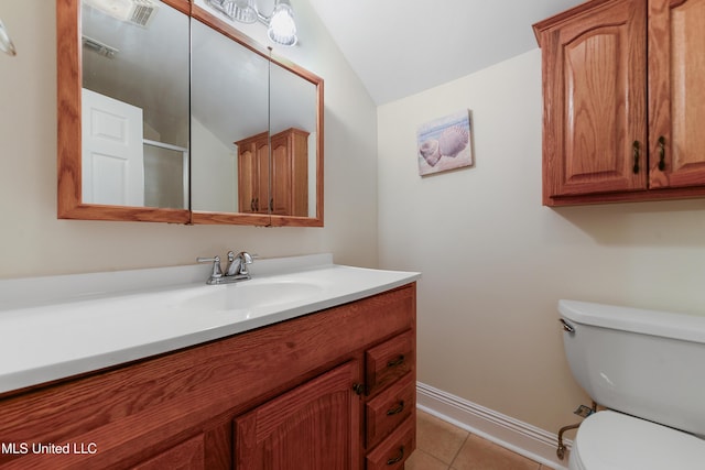 bathroom featuring lofted ceiling, visible vents, toilet, vanity, and tile patterned floors