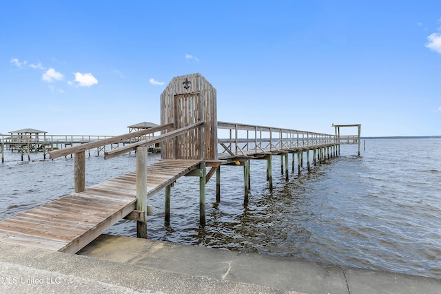 dock area featuring a water view