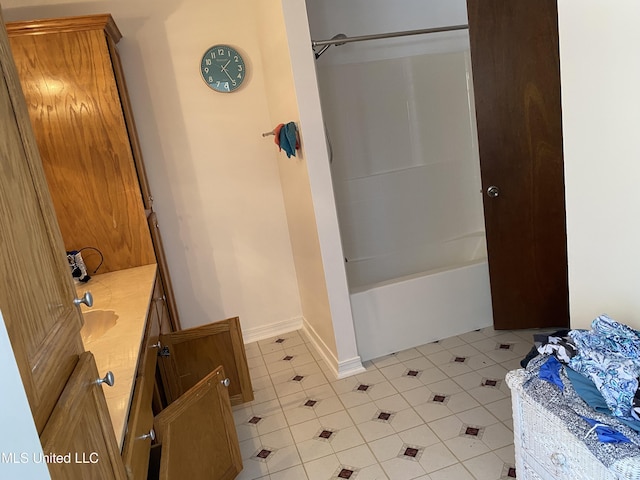 bathroom with tile patterned floors, vanity, and shower / bath combination