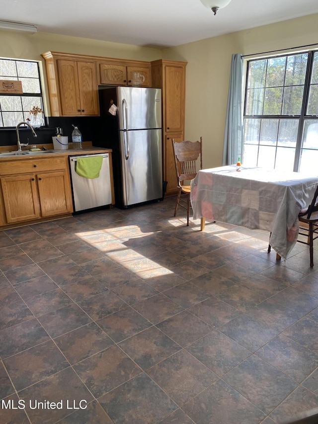 kitchen with appliances with stainless steel finishes and sink