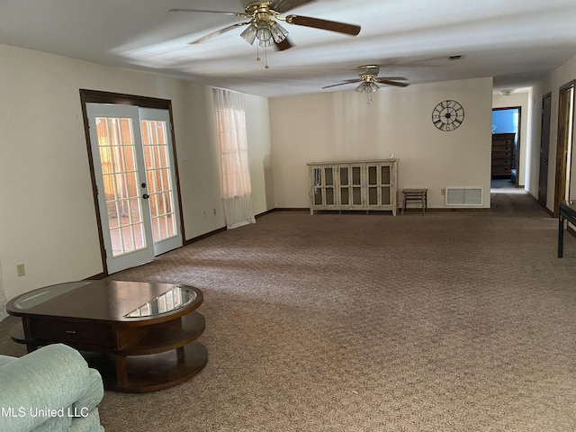 carpeted living room featuring ceiling fan