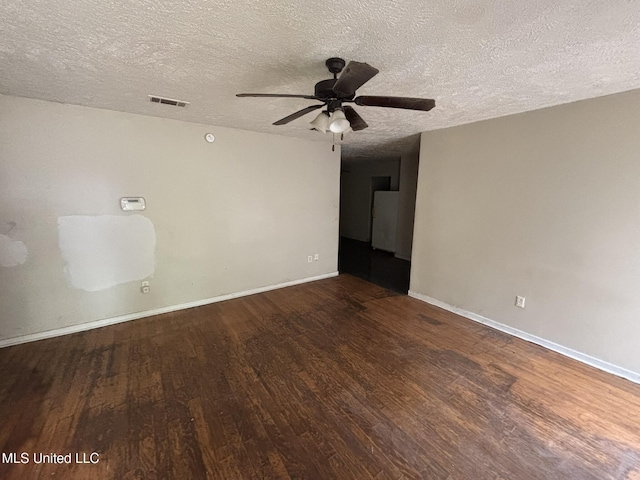 1143 Oak Glen Pl, Jackson, MS 39212 - unfurnished room with wood finished floors, ceiling fan, a textured ceiling, and baseboards