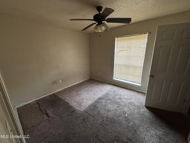 1143 Oak Glen Pl, Jackson, MS 39212 - carpeted empty room with a ceiling fan, baseboards, and a textured ceiling