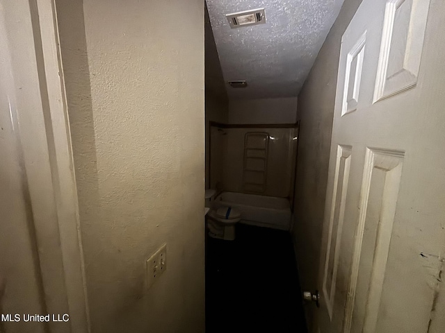 1143 Oak Glen Pl, Jackson, MS 39212 - hallway featuring a textured ceiling