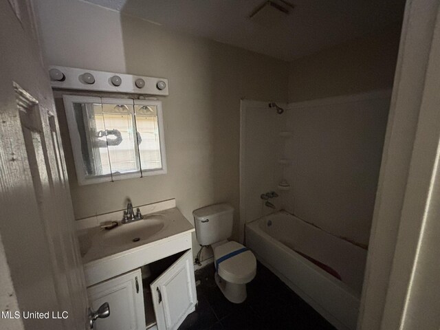 1143 Oak Glen Pl, Jackson, MS 39212 - bathroom featuring vanity, toilet, tile patterned floors, and washtub / shower combination