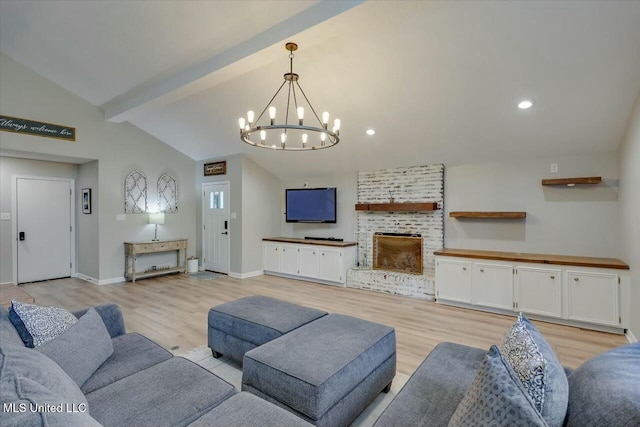 living area with a chandelier, light wood finished floors, a fireplace, recessed lighting, and vaulted ceiling with beams
