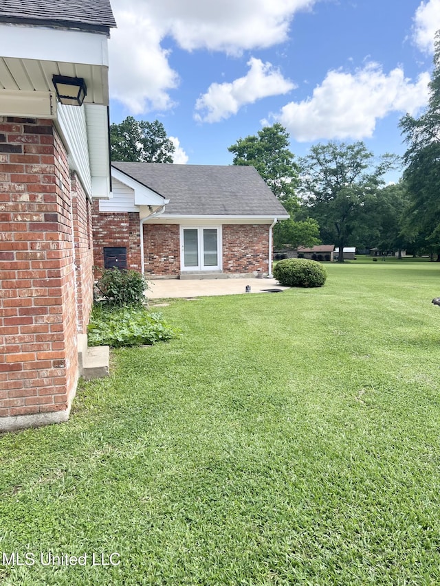 324 Bob White Dr, Canton, MS 39046 - view of green lawn with a patio area