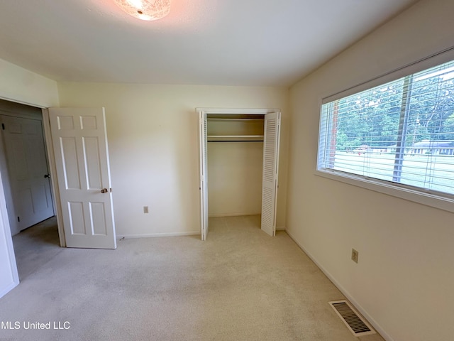 324 Bob White Dr, Canton, MS 39046 - unfurnished bedroom with light carpet, a closet, and baseboards