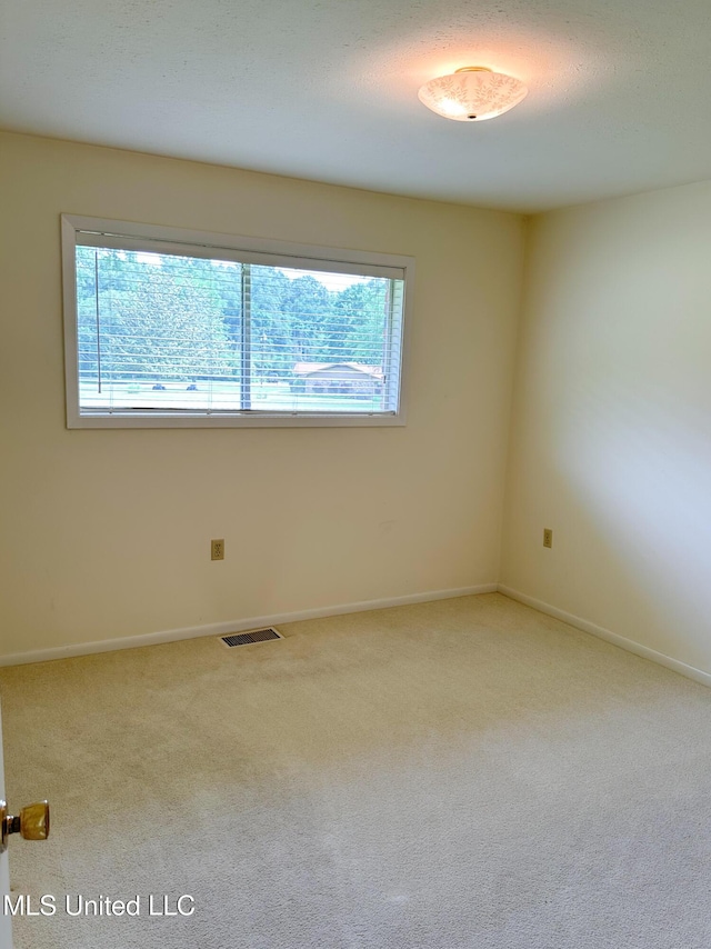 324 Bob White Dr, Canton, MS 39046 - spare room featuring carpet floors and baseboards