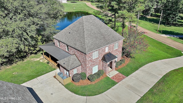 birds eye view of property with a water view