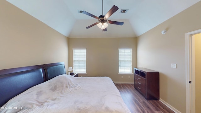 bedroom featuring vaulted ceiling, ceiling fan, and dark hardwood / wood-style flooring