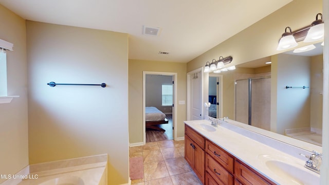 bathroom with vanity, separate shower and tub, and tile patterned flooring