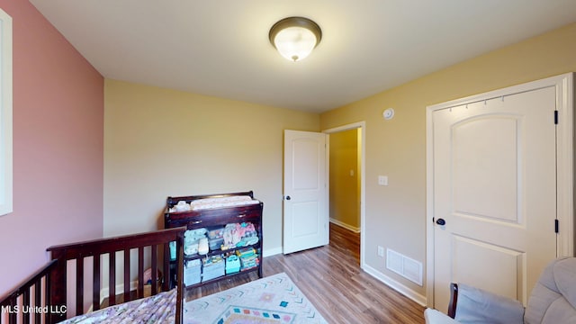 bedroom with light hardwood / wood-style flooring