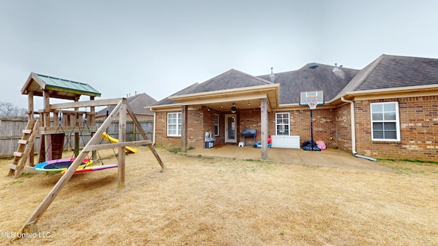 view of playground featuring a trampoline and a patio area