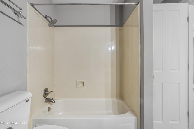 bathroom featuring toilet and shower / bath combination