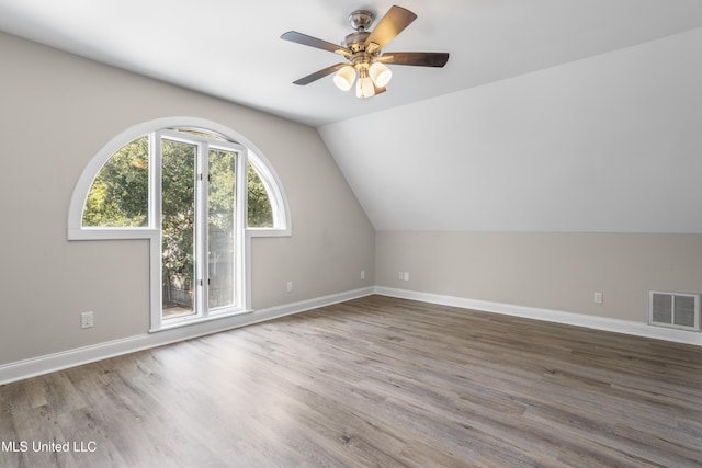 bonus room featuring wood-type flooring, vaulted ceiling, and ceiling fan