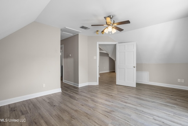 bonus room featuring ceiling fan, light hardwood / wood-style floors, and vaulted ceiling