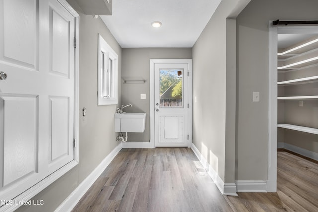 doorway featuring light hardwood / wood-style floors and sink