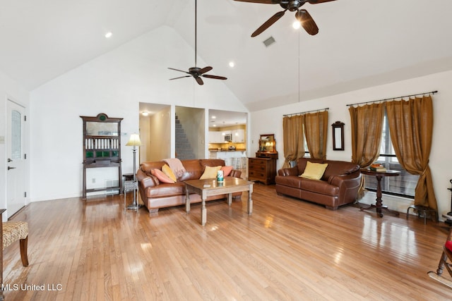 112 Dogwood Ln, Pass Christian, MS 39571 - living room with high vaulted ceiling, a ceiling fan, light wood finished floors, stairway, and recessed lighting