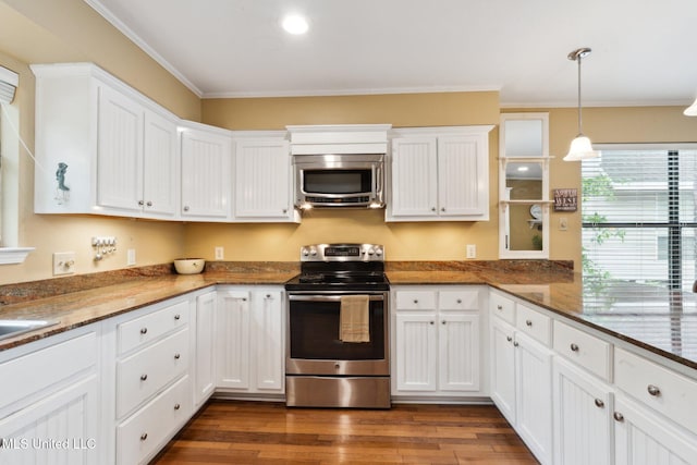112 Dogwood Ln, Pass Christian, MS 39571 - kitchen featuring stainless steel appliances, ornamental molding, white cabinets, dark wood-type flooring, and dark stone counters