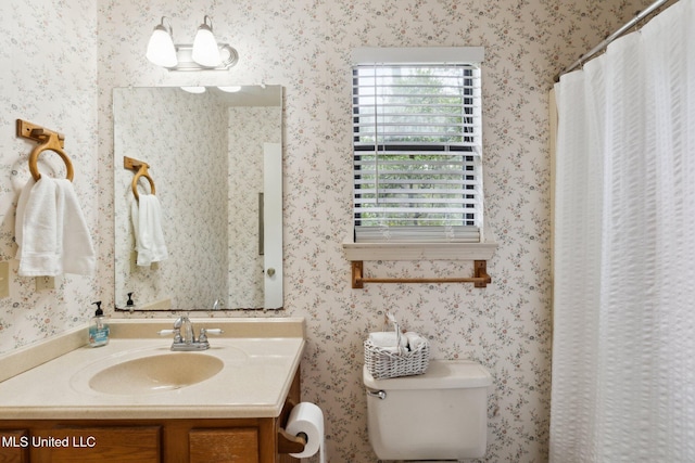 112 Dogwood Ln, Pass Christian, MS 39571 - bathroom with vanity, toilet, wallpapered walls, and curtained shower