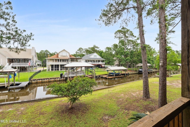 112 Dogwood Ln, Pass Christian, MS 39571 - dock with a water view, boat lift, and a lawn