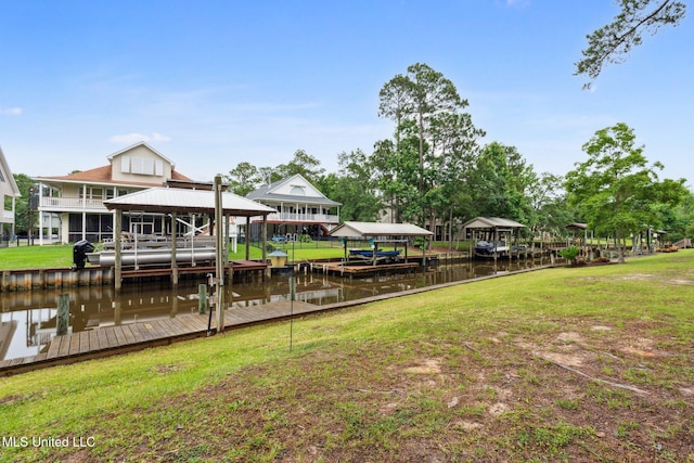 112 Dogwood Ln, Pass Christian, MS 39571 - dock with boat lift, a water view, and a lawn