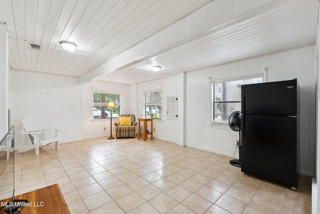 112 Dogwood Ln, Pass Christian, MS 39571 - sitting room featuring light tile patterned floors, plenty of natural light, and beamed ceiling