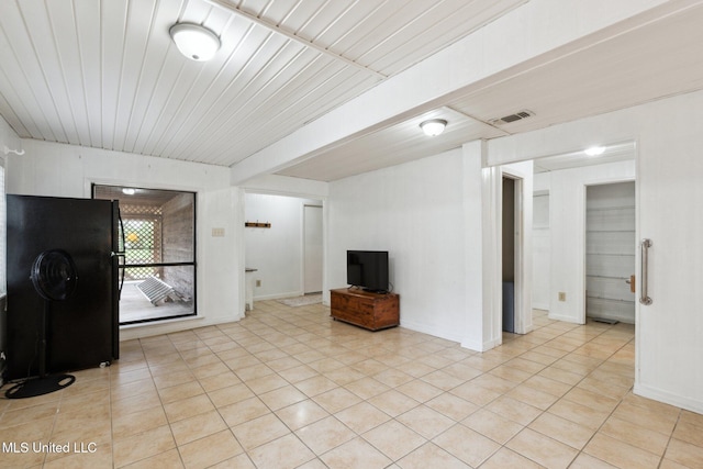 112 Dogwood Ln, Pass Christian, MS 39571 - unfurnished living room with light tile patterned floors and baseboards
