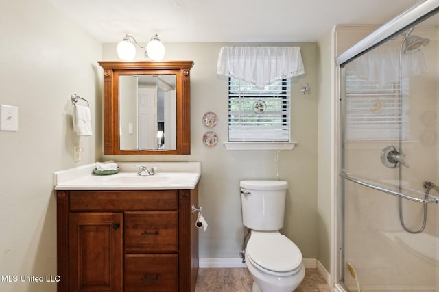 112 Dogwood Ln, Pass Christian, MS 39571 - bathroom featuring vanity, a stall shower, toilet, and baseboards