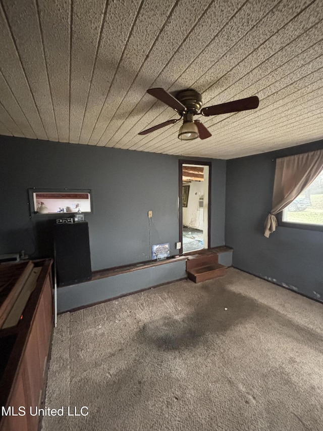 interior space with ceiling fan