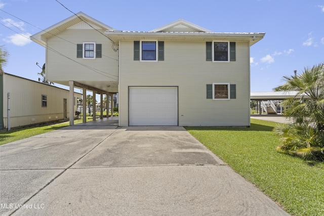 855 Dove Blvd, Bay Saint Louis, MS 39520 - beach home with a garage, concrete driveway, a front lawn, and a carport