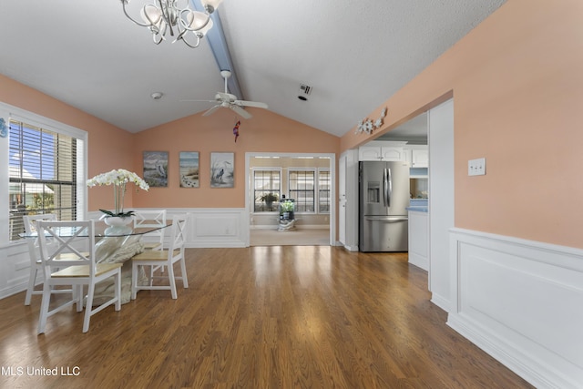855 Dove Blvd, Bay Saint Louis, MS 39520 - dining space with a decorative wall, ceiling fan, wainscoting, wood finished floors, and a chandelier