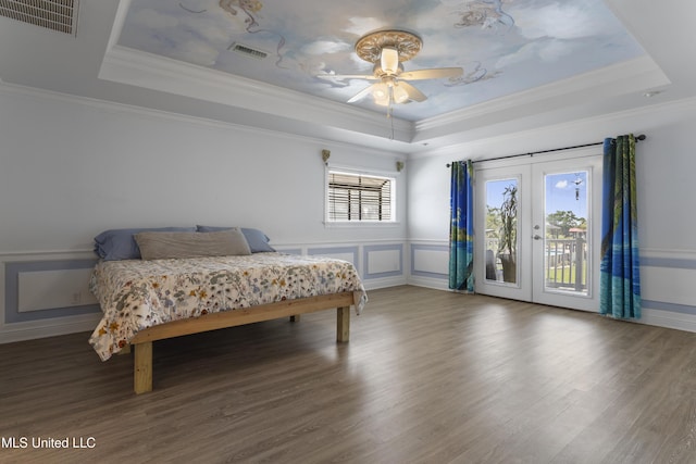 855 Dove Blvd, Bay Saint Louis, MS 39520 - bedroom with a tray ceiling, access to exterior, french doors, wood finished floors, and crown molding