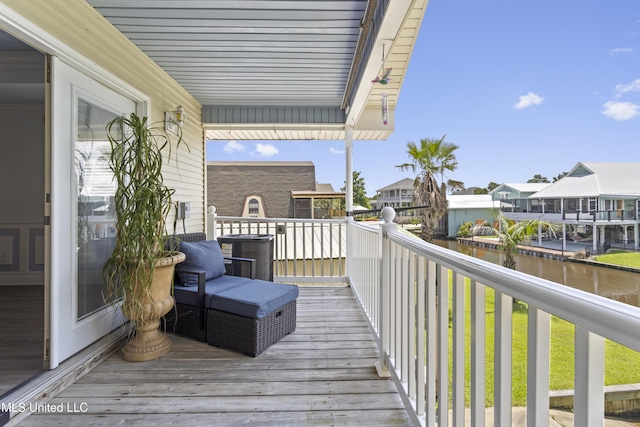 855 Dove Blvd, Bay Saint Louis, MS 39520 - wooden deck featuring a residential view and a water view