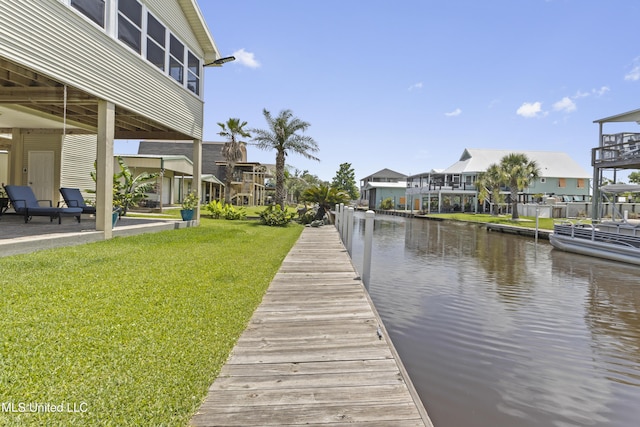 855 Dove Blvd, Bay Saint Louis, MS 39520 - dock with a water view, a lawn, and a residential view