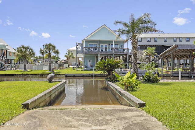 855 Dove Blvd, Bay Saint Louis, MS 39520 - view of community featuring a boat ramp, a water view, and a lawn