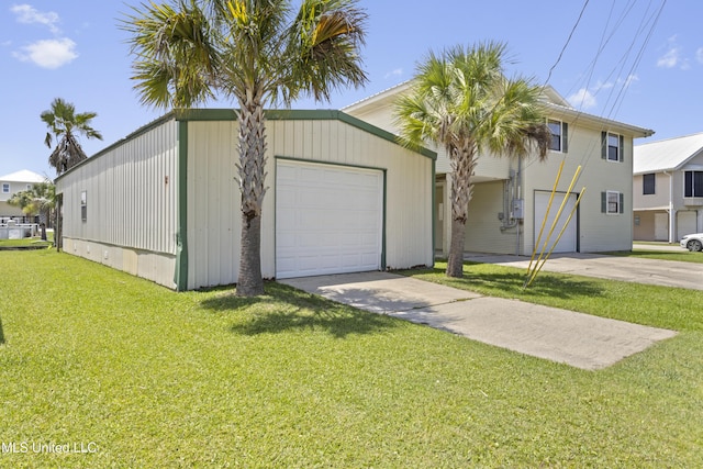 855 Dove Blvd, Bay Saint Louis, MS 39520 - view of front of home with driveway, a front lawn, and an attached garage