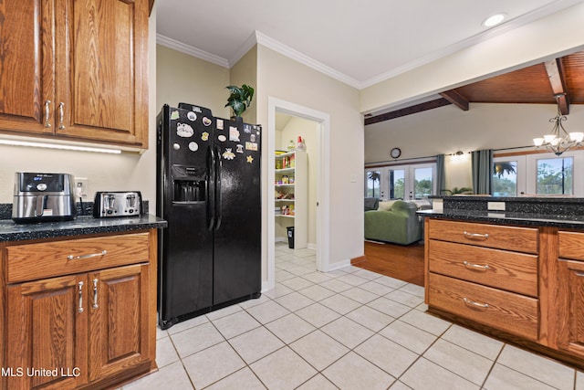 kitchen featuring french doors, black refrigerator with ice dispenser, light tile patterned floors, a notable chandelier, and vaulted ceiling with beams